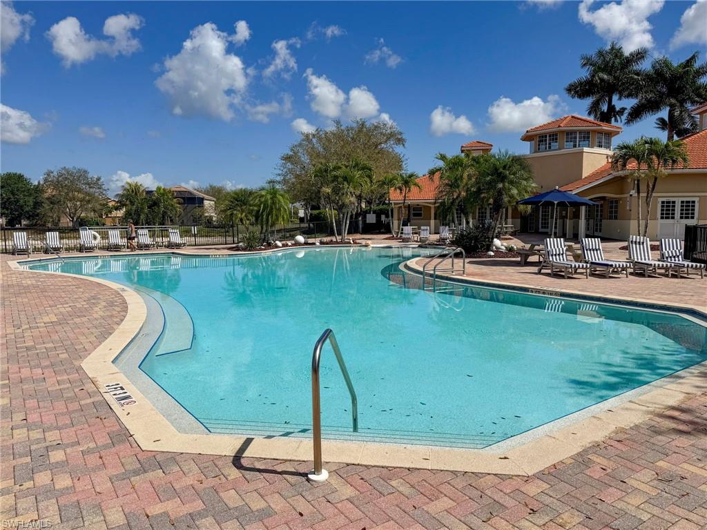 2094 Grove Drive Naples, FL 34120 - Photo 37 of 40 a view of a swimming pool with a patio