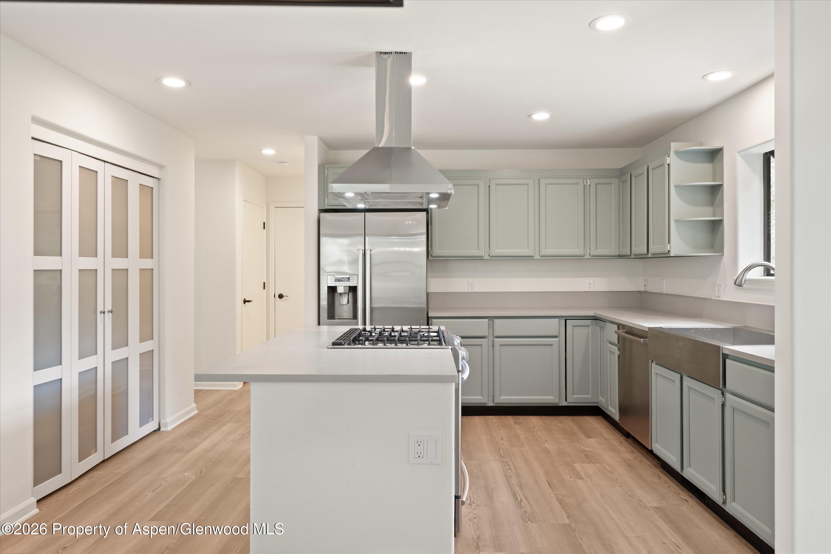 1007 Lauren Lane Basalt, CO 81621 - Photo 3 of 3 a kitchen with stainless steel appliances granite countertop a sink stove and refrigerator