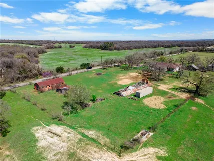 a view of a lake with a yard