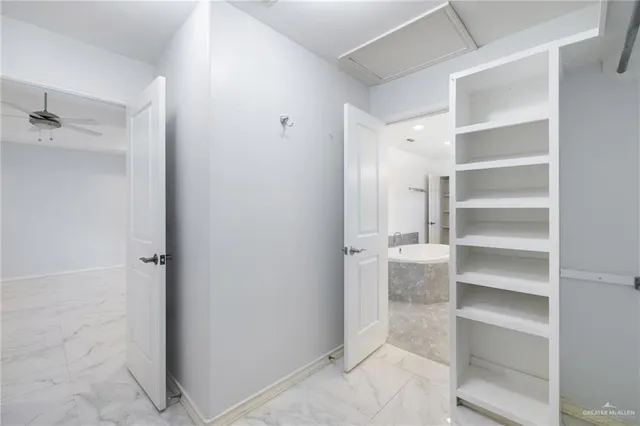 a view of an empty walk in closet