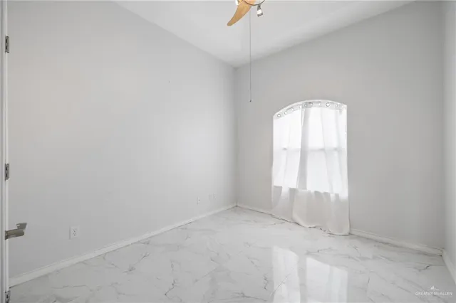 a spacious bathroom with a bathtub double sink and mirror