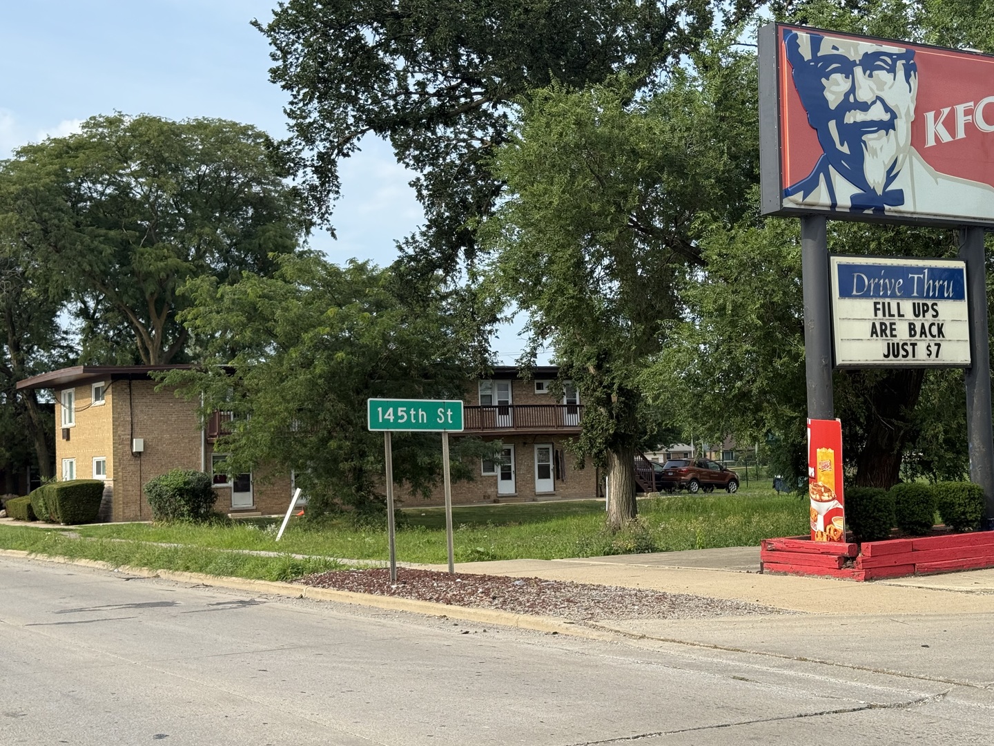 14539 Crawford Avenue Midlothian, IL 60445 - Photo 3 of 5 a sign that is on the side of a road