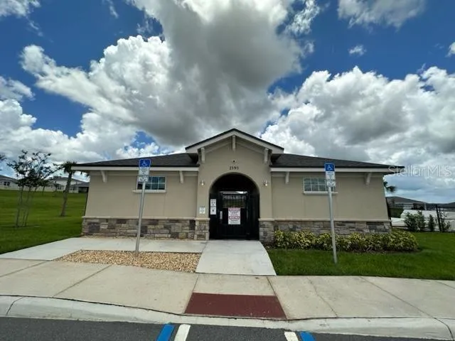 a view of a porch with chairs and a grill