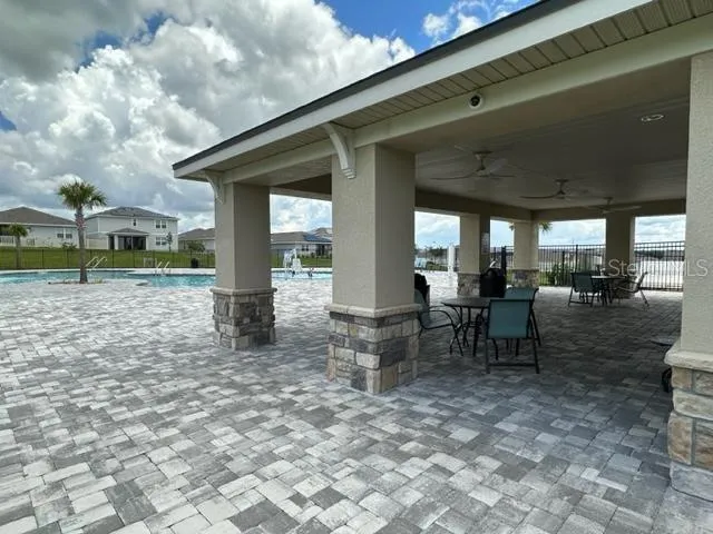 a view of a park with large trees