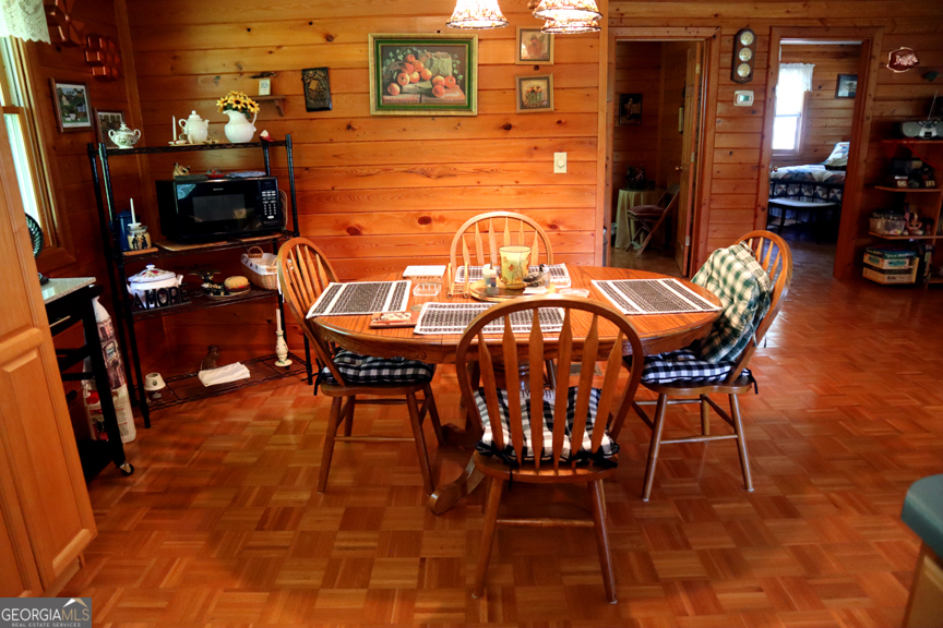 671 Pine Lake Sparta, GA 31087 - Photo 11 of 31 a view of a patio with table and chairs