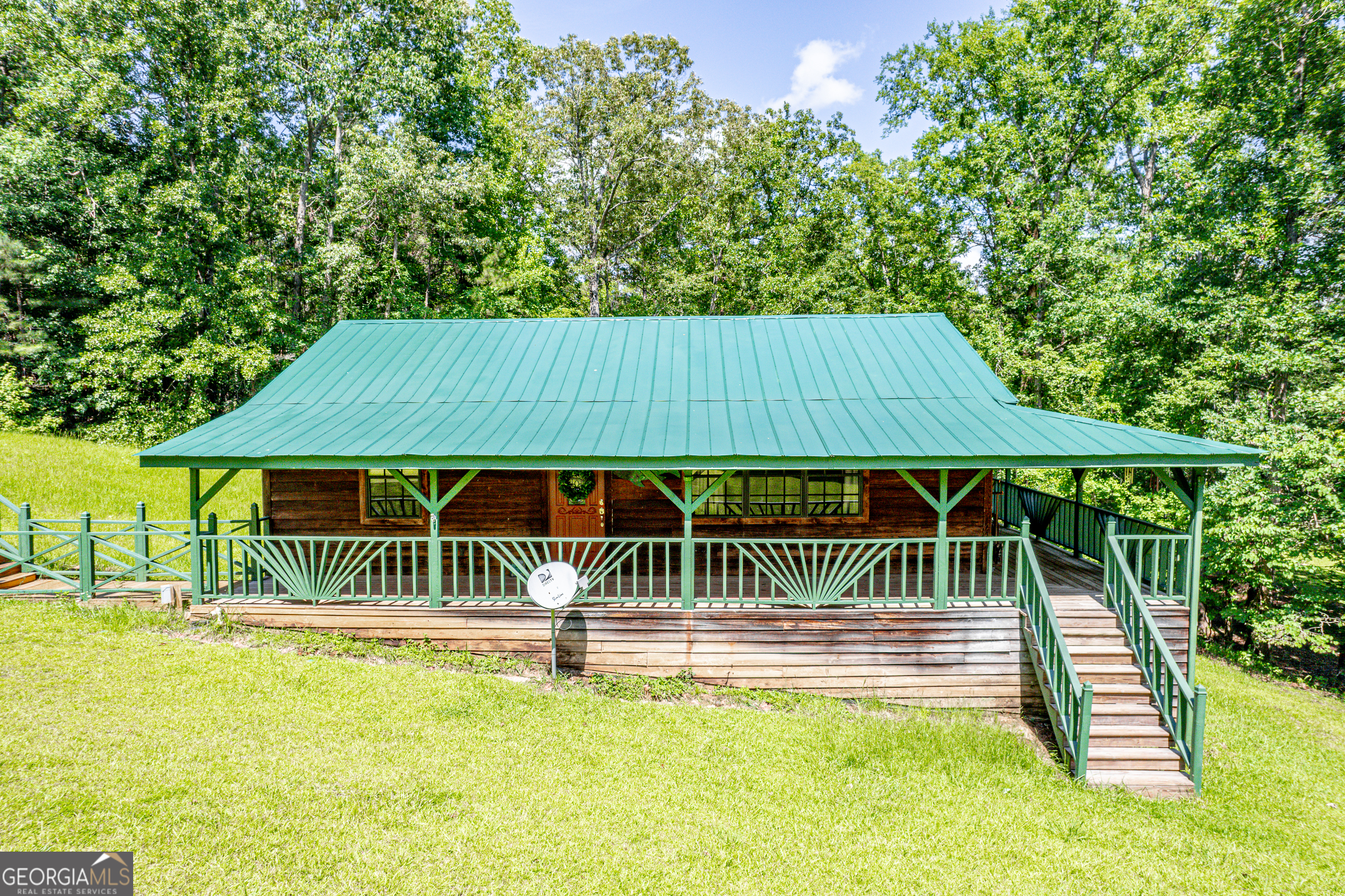 671 Pine Lake Sparta, GA 31087 - Photo 15 of 31 a view of swimming pool with deck and backyard