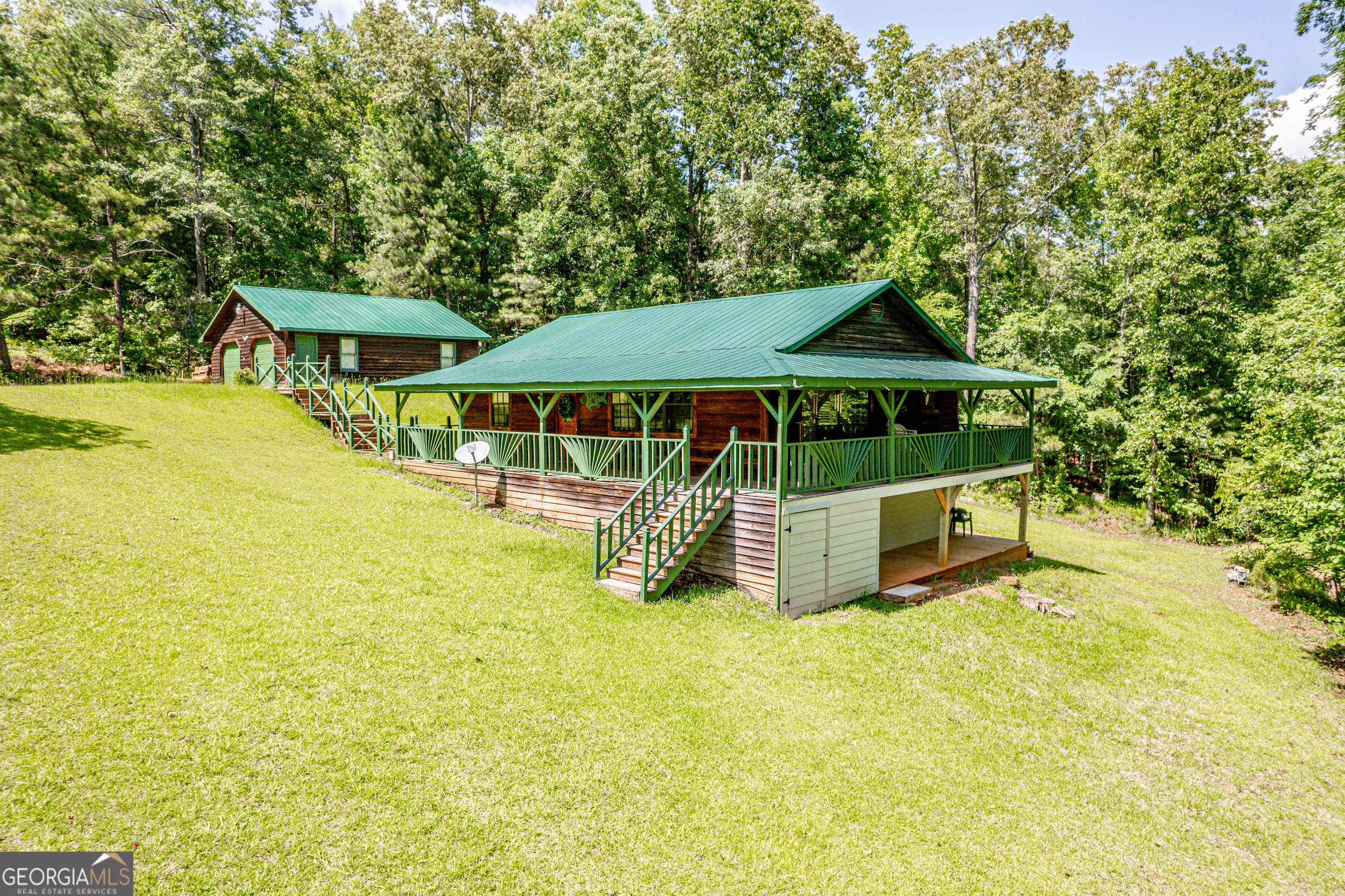 671 Pine Lake Sparta, GA 31087 - Photo 16 of 31 a view of a house with swimming pool and porch with furniture