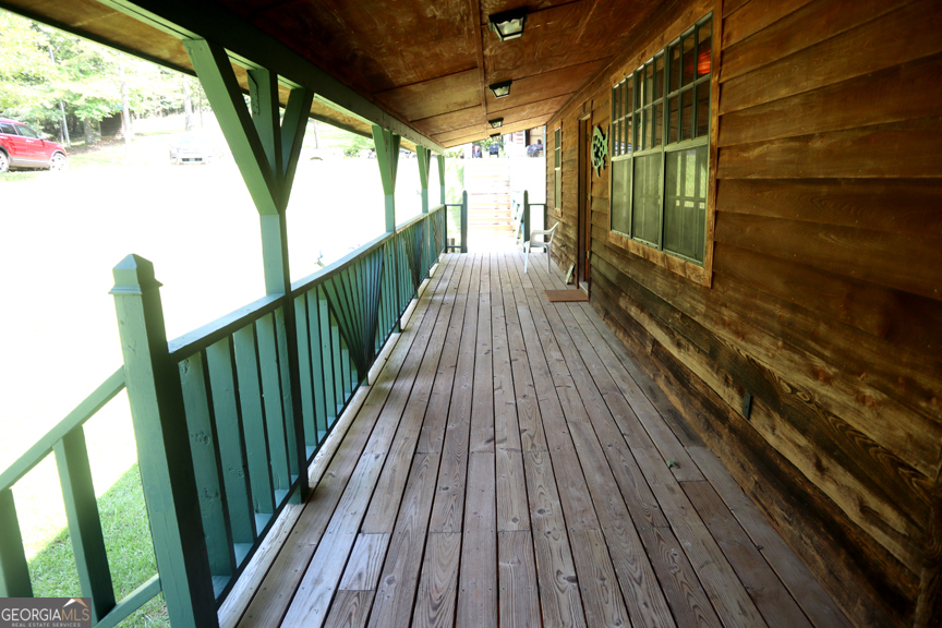 671 Pine Lake Sparta, GA 31087 - Photo 17 of 31 a view of balcony with wooden floor
