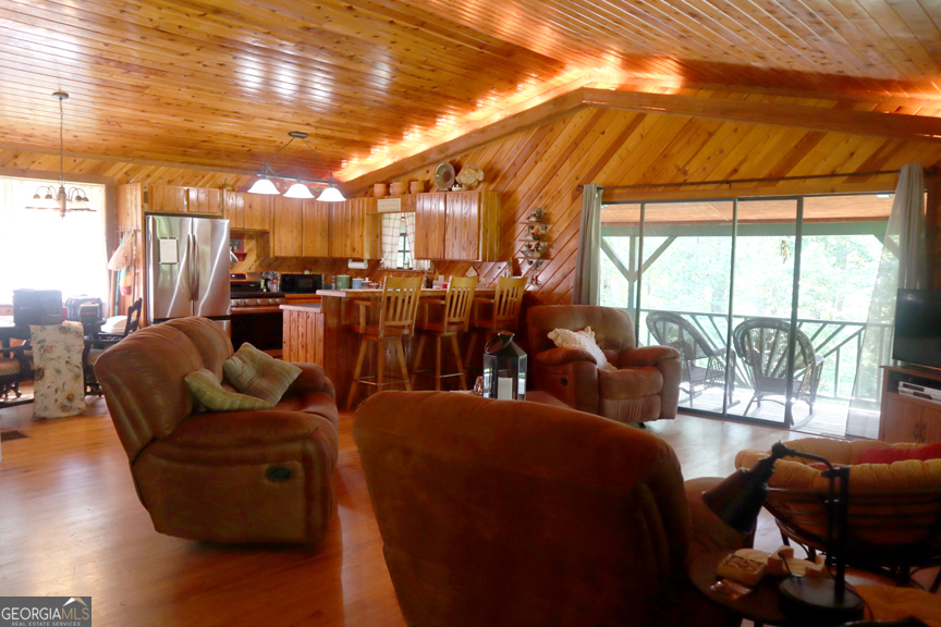 671 Pine Lake Sparta, GA 31087 - Photo 19 of 31 a living room with furniture and a large window