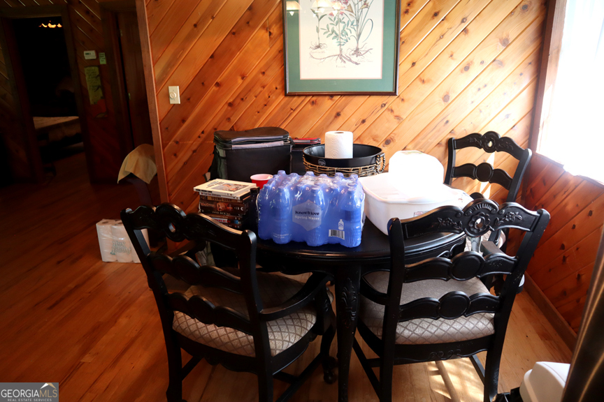 671 Pine Lake Sparta, GA 31087 - Photo 23 of 31 a dining room with furniture and wooden floor
