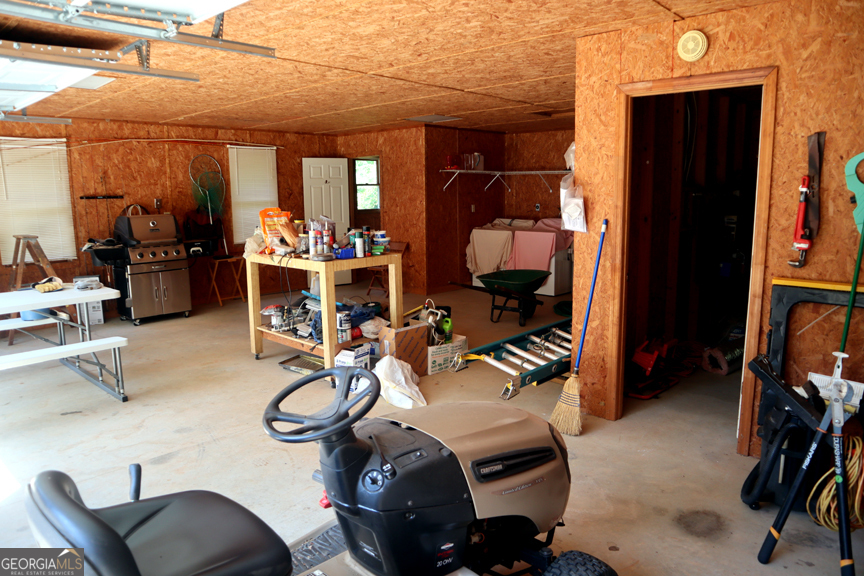 671 Pine Lake Sparta, GA 31087 - Photo 5 of 31 a view of a room with gym equipment