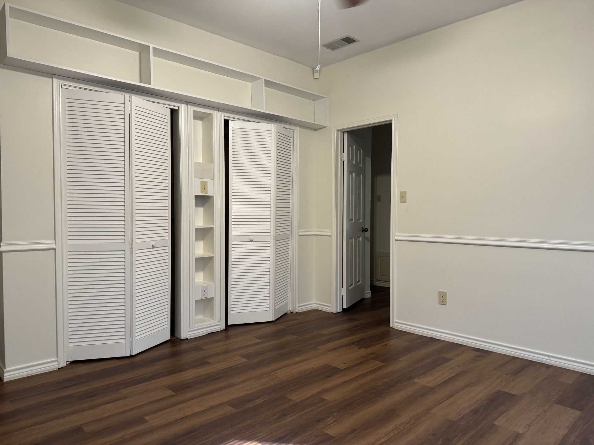 12223 A Old Huffmeister Road Cypress, TX 77429 - Photo 16 of 31 an empty room with wooden floor and closet