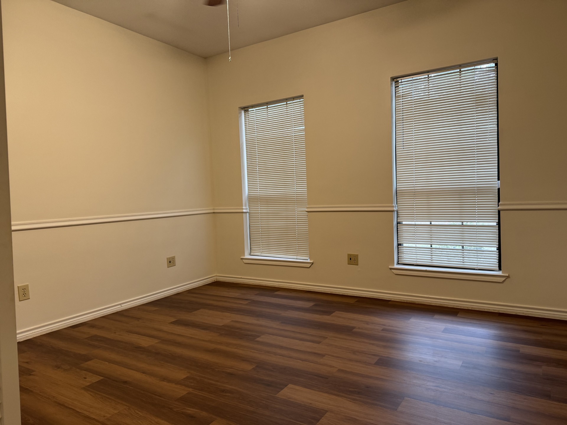 12223 A Old Huffmeister Road Cypress, TX 77429 - Photo 19 of 31 an empty room with wooden floor and windows