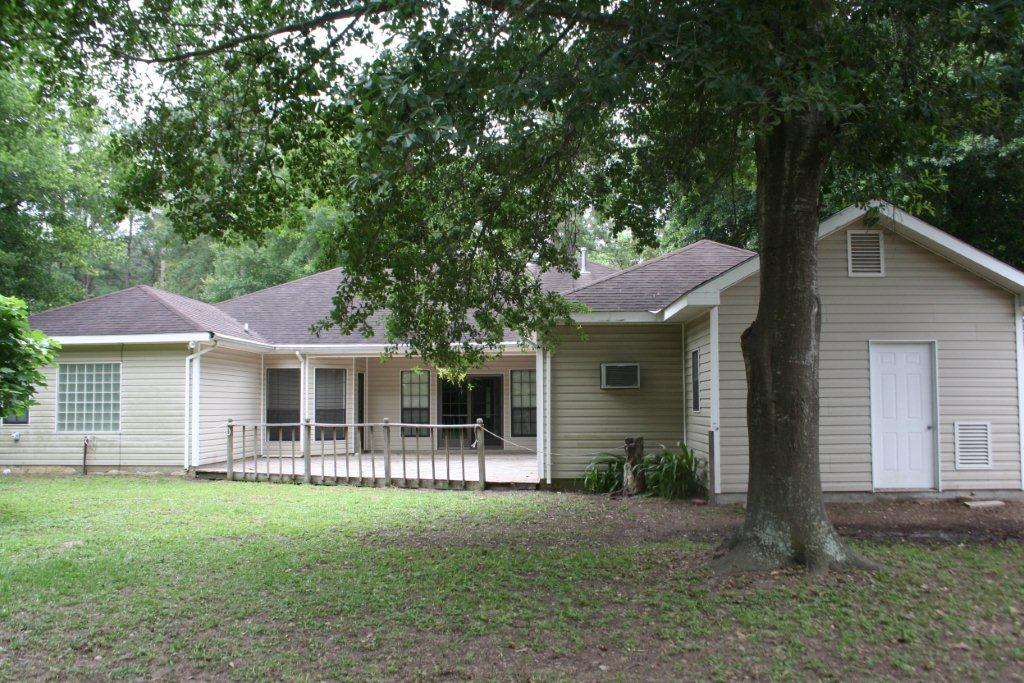 12223 A Old Huffmeister Road Cypress, TX 77429 - Photo 2 of 31 a front view of a house with a garden