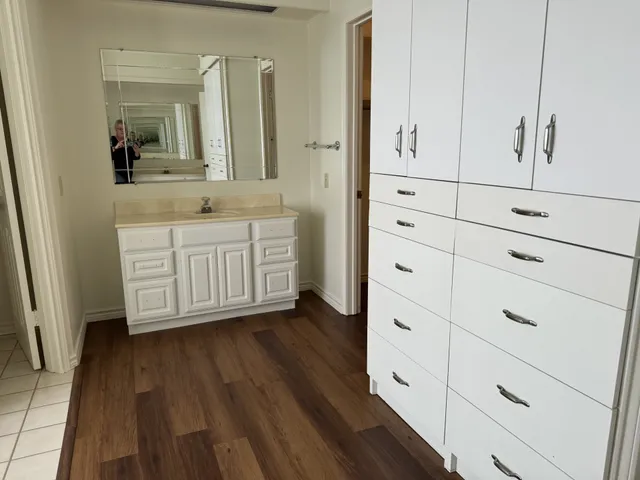 a bathroom with a double vanity sink and mirror