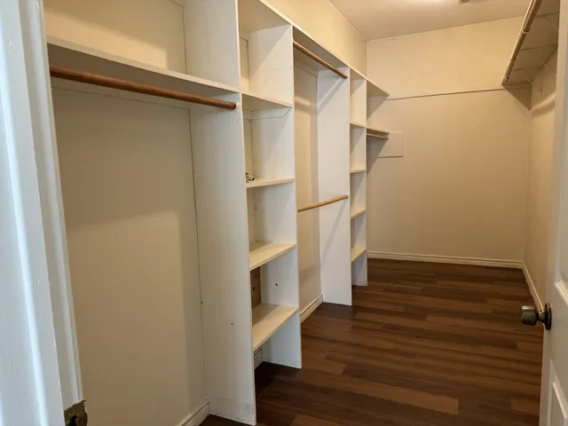 a view of entryway with wooden floor and staircase