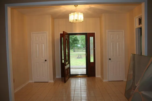 a view of a hallway with windows