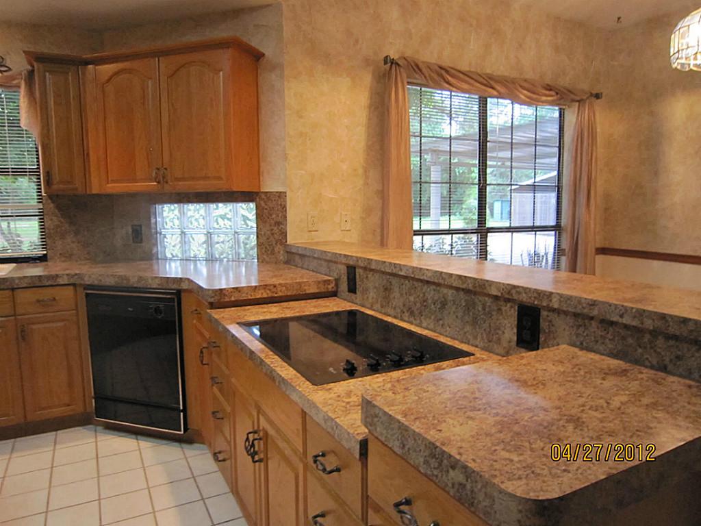 12223 A Old Huffmeister Road Cypress, TX 77429 - Photo 6 of 31 a kitchen that has a sink and a stove in it