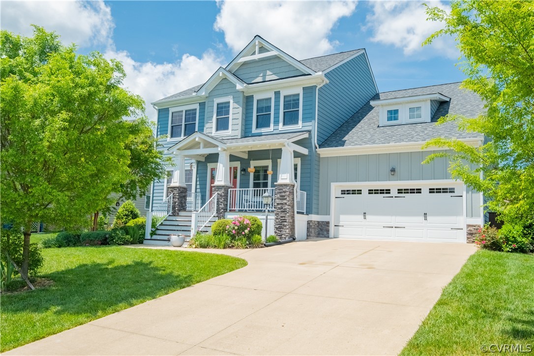 4935 Turner Ridge Court Glen Allen, VA 23059 - Photo 1 of 50 a view of a white house with a big yard and potted plants
