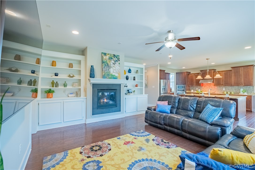 4935 Turner Ridge Court Glen Allen, VA 23059 - Photo 19 of 50 a living room with furniture and a fireplace