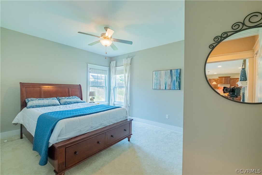 4935 Turner Ridge Court Glen Allen, VA 23059 - Photo 21 of 50 a bedroom with a bed and a mirror