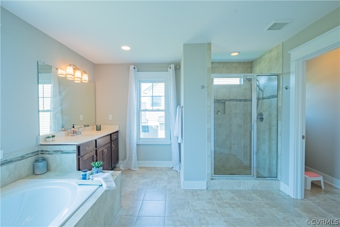 4935 Turner Ridge Court Glen Allen, VA 23059 - Photo 33 of 50 a bathroom with a tub a sink and mirror