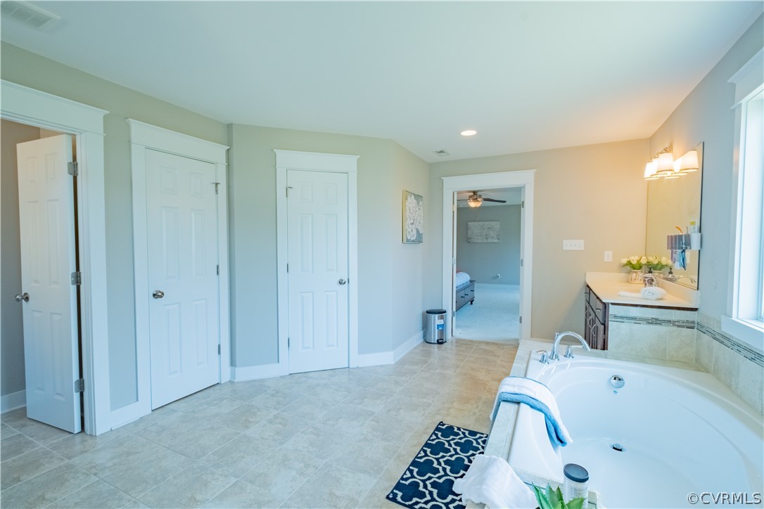 4935 Turner Ridge Court Glen Allen, VA 23059 - Photo 34 of 50 a bathroom with a bathtub and a sink