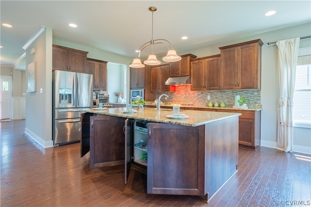 4935 Turner Ridge Court Glen Allen, VA 23059 - Photo 8 of 50 a kitchen with kitchen island granite countertop wooden floors and a view of living room