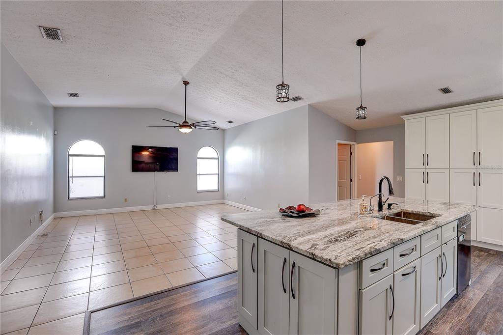 1418 Buckner Road Valrico, FL 33596 - Photo 20 of 37 a kitchen with kitchen island a counter space a sink stainless steel appliances and cabinets