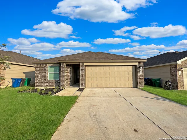 a front view of a house with a yard and porch
