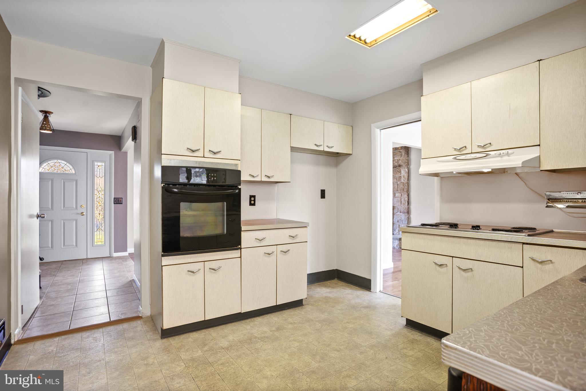 330 Church Lane Road Reading, PA 19606 - Photo 11 of 33 a kitchen with granite countertop white cabinets and white appliances