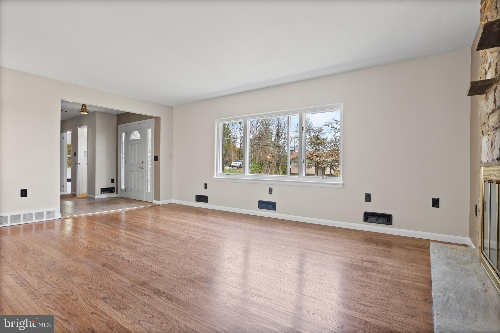 330 Church Lane Road Reading, PA 19606 - Photo 4 of 33 a view of an empty room with wooden floor and a window