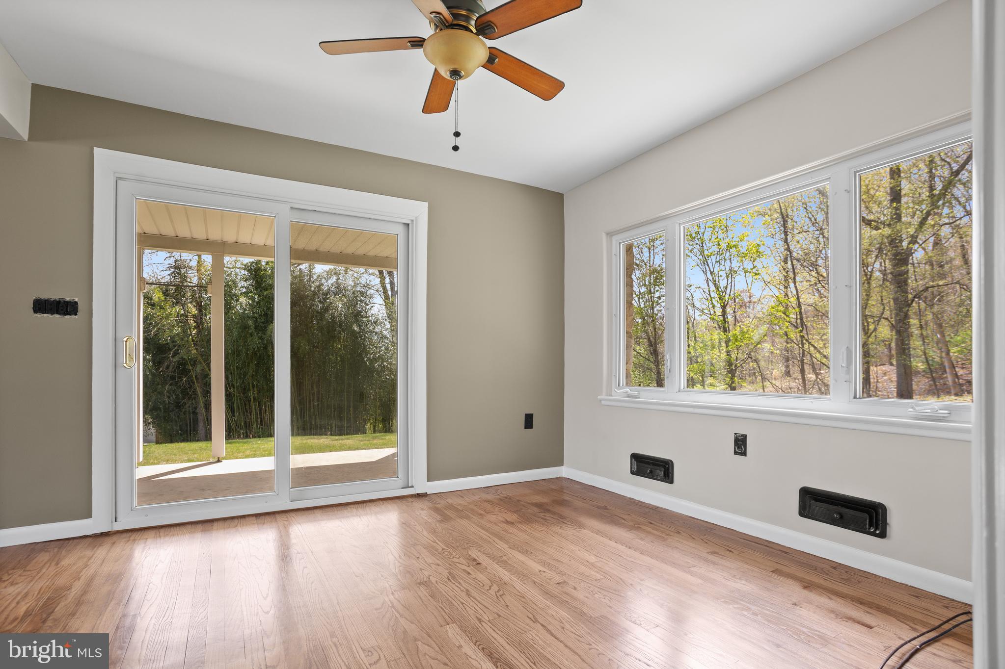 330 Church Lane Road Reading, PA 19606 - Photo 8 of 33 a view of an empty room with wooden floor and a window