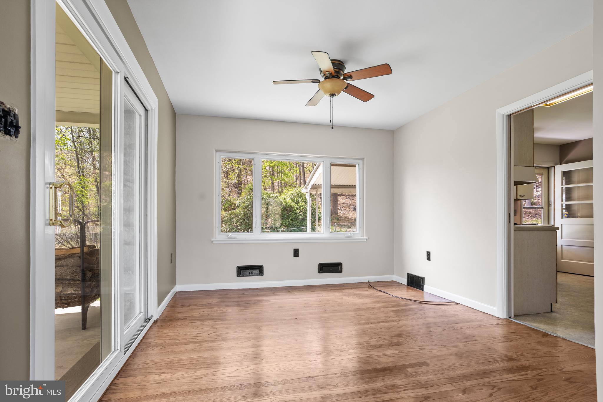 330 Church Lane Road Reading, PA 19606 - Photo 9 of 33 a view of empty room with wooden floor and fan
