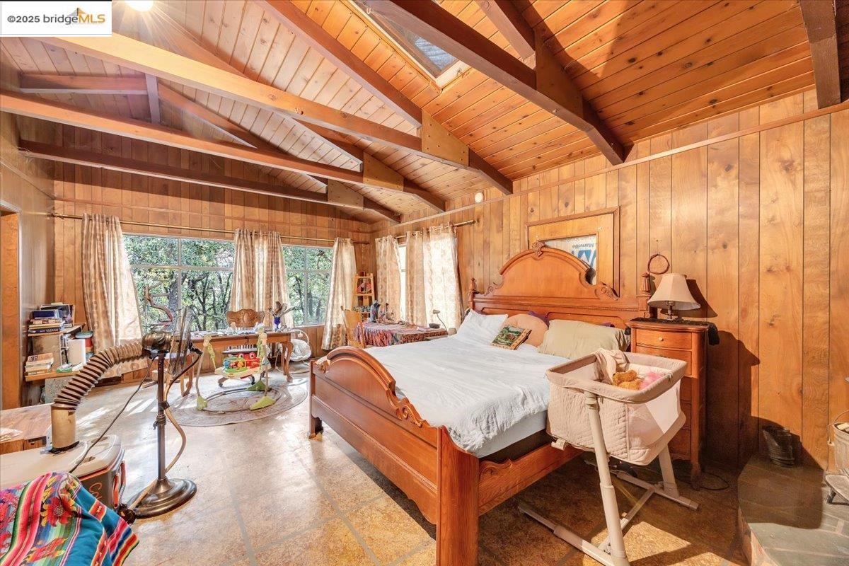 25300 Italian Bar Road Columbia, CA 95310 - Photo 11 of 60 a bedroom with furniture and a large window