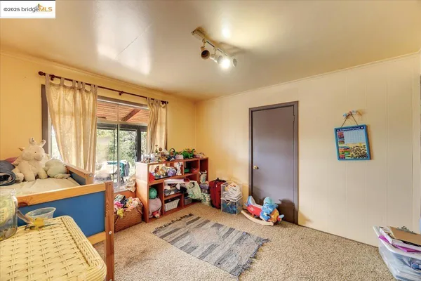 a view of a lake with houses in the back