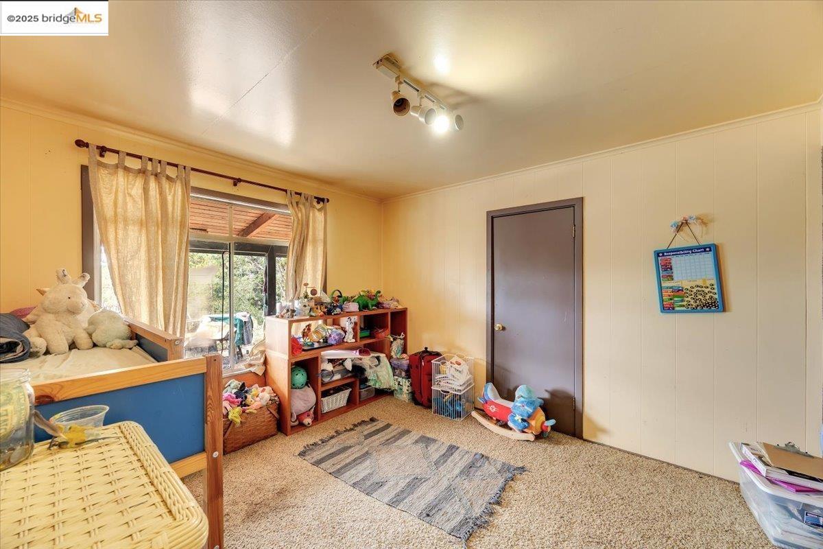 25300 Italian Bar Road Columbia, CA 95310 - Photo 14 of 60 a bed room with a bed and a couch