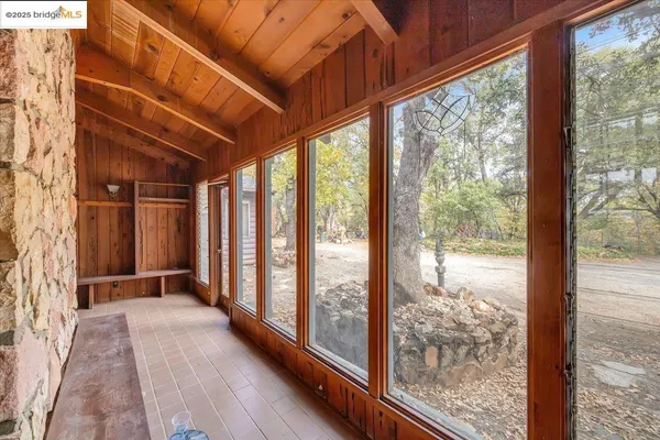 a front view of a house with a yard and seating space