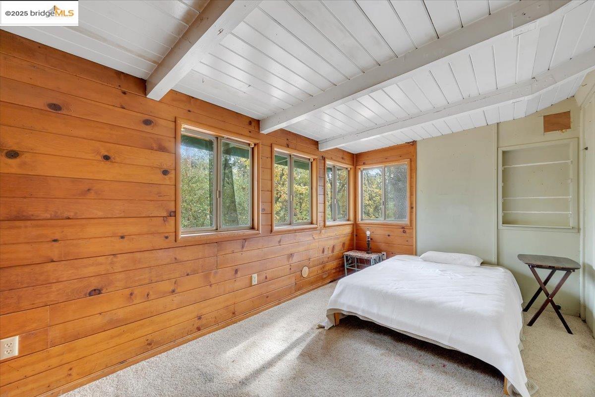 25300 Italian Bar Road Columbia, CA 95310 - Photo 36 of 60 a bedroom with a bed and wooden floor