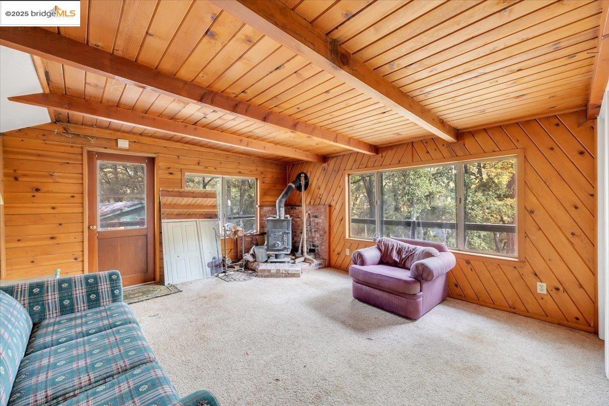 25300 Italian Bar Road Columbia, CA 95310 - Photo 38 of 60 a living room with furniture and a large window