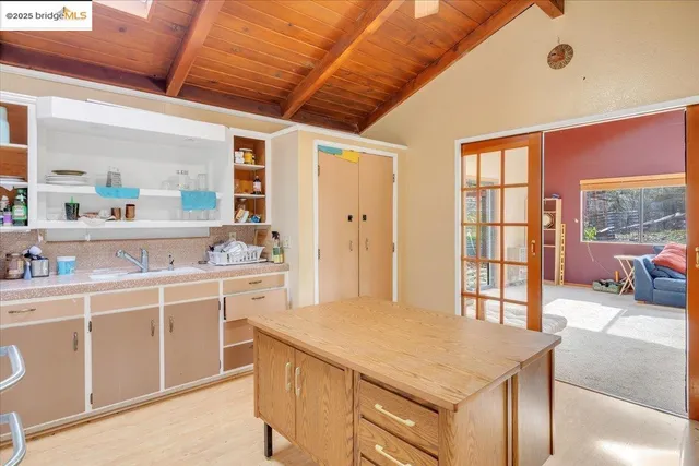 a view of a patio with a table and chairs