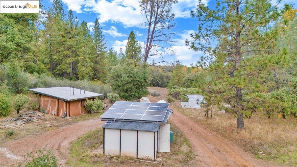 25300 Italian Bar Road Columbia, CA 95310 - Photo 42 of 60 a view of a wooden dinning table and chairs in the patio