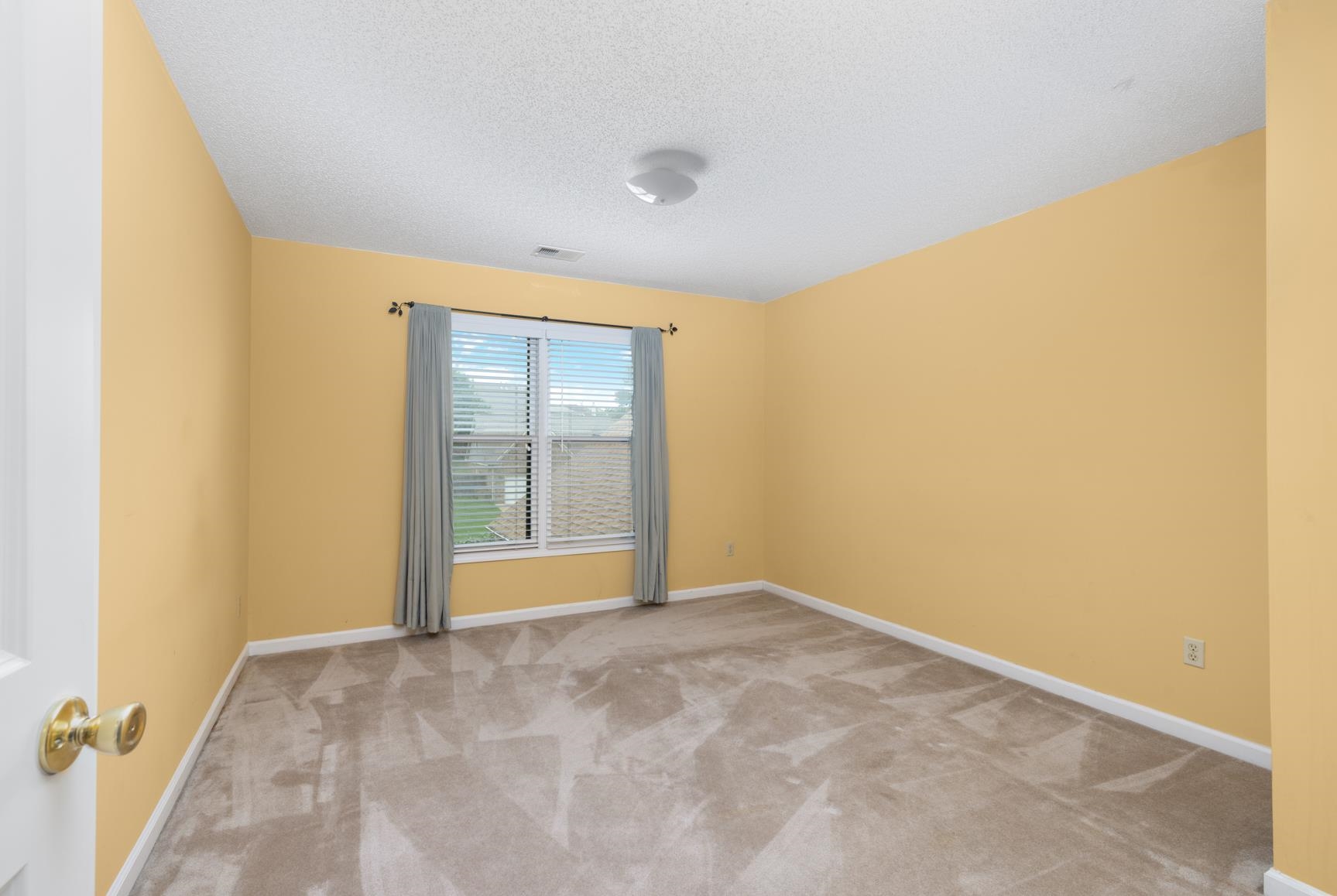 9015 Raspberry Lane Cordova, TN 38016 - Photo 34 of 40 Carpeted spare room with a textured ceiling