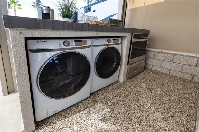a dining room with furniture and a floor to ceiling window