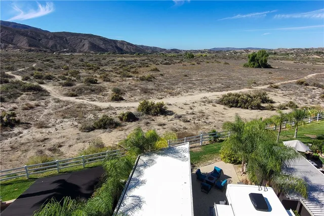 a view of residential house with outdoor space and lake view