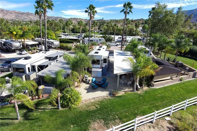 a view of a backyard with sitting area