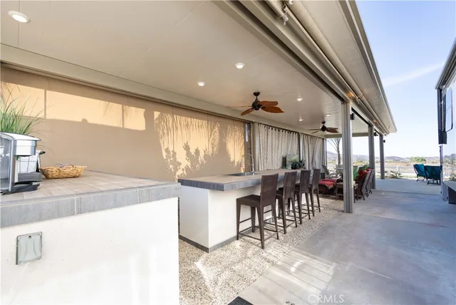 a kitchen with a sink appliances and cabinets