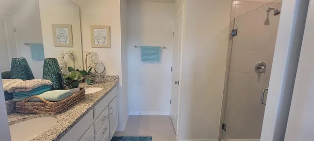 a bathroom with a sink a mirror and vanity