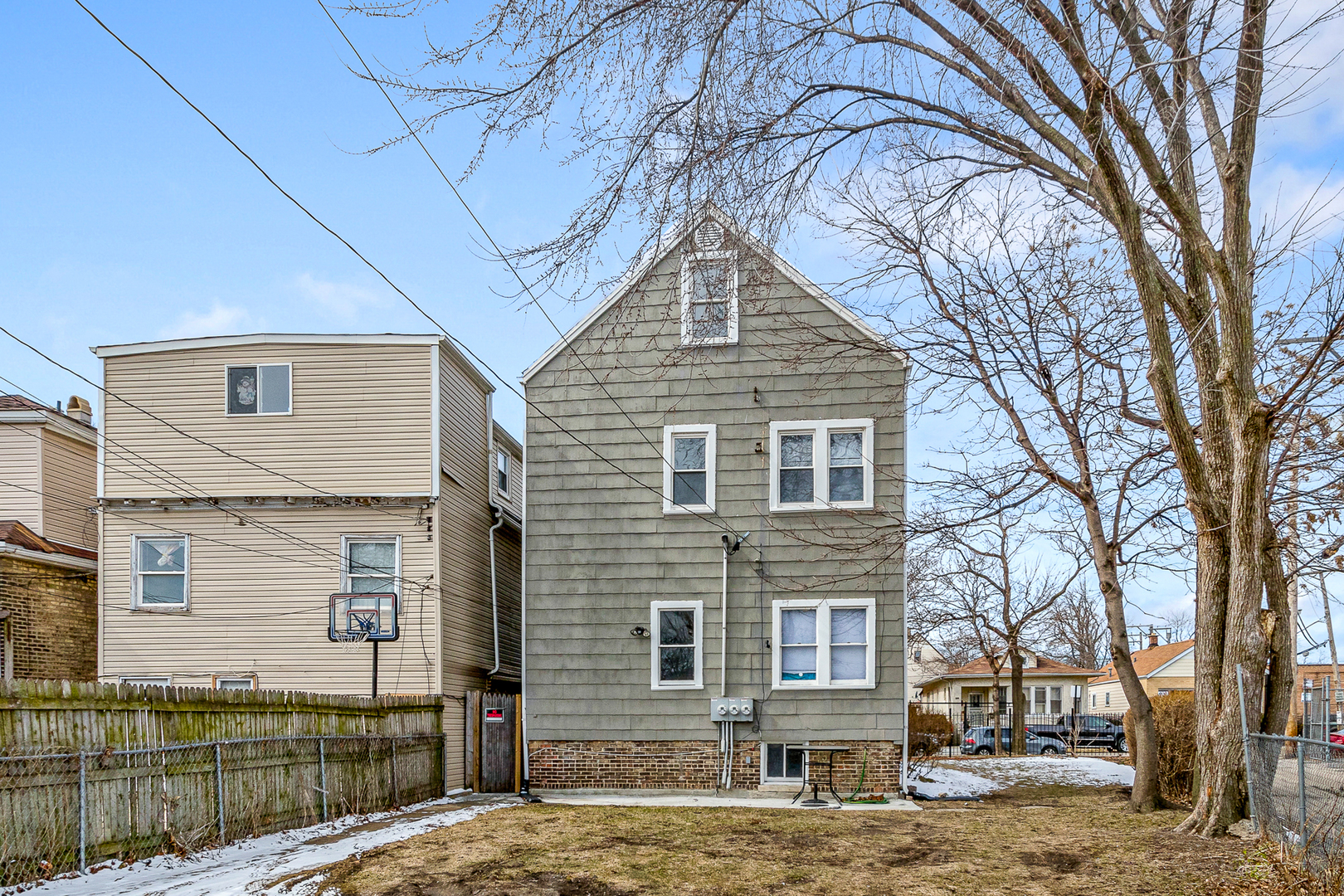 2135 North Menard Avenue, Unit 3 Chicago, IL 60639 - Photo 8 of 10 a front view of a house with a yard