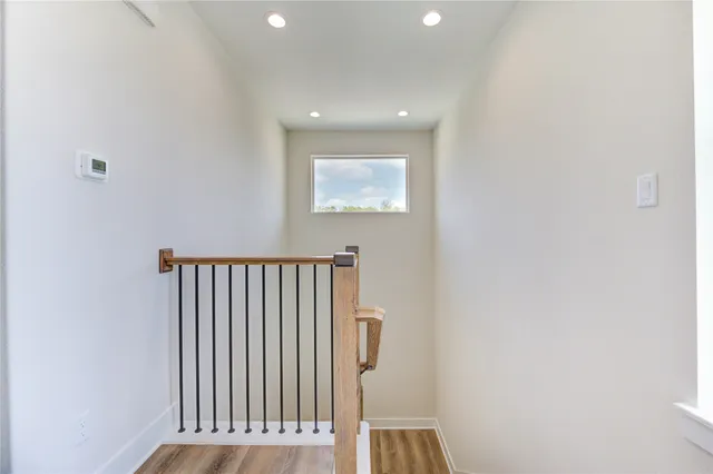 a view of a hallway with windows